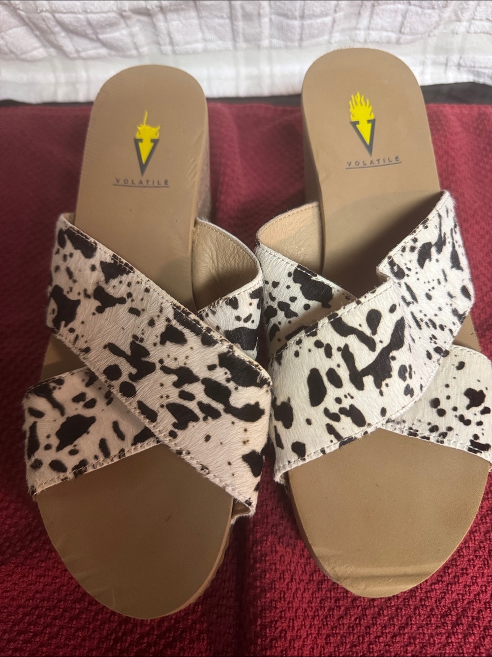 Volatile Cow-Print Crisscross Wedge Slides in Black & White